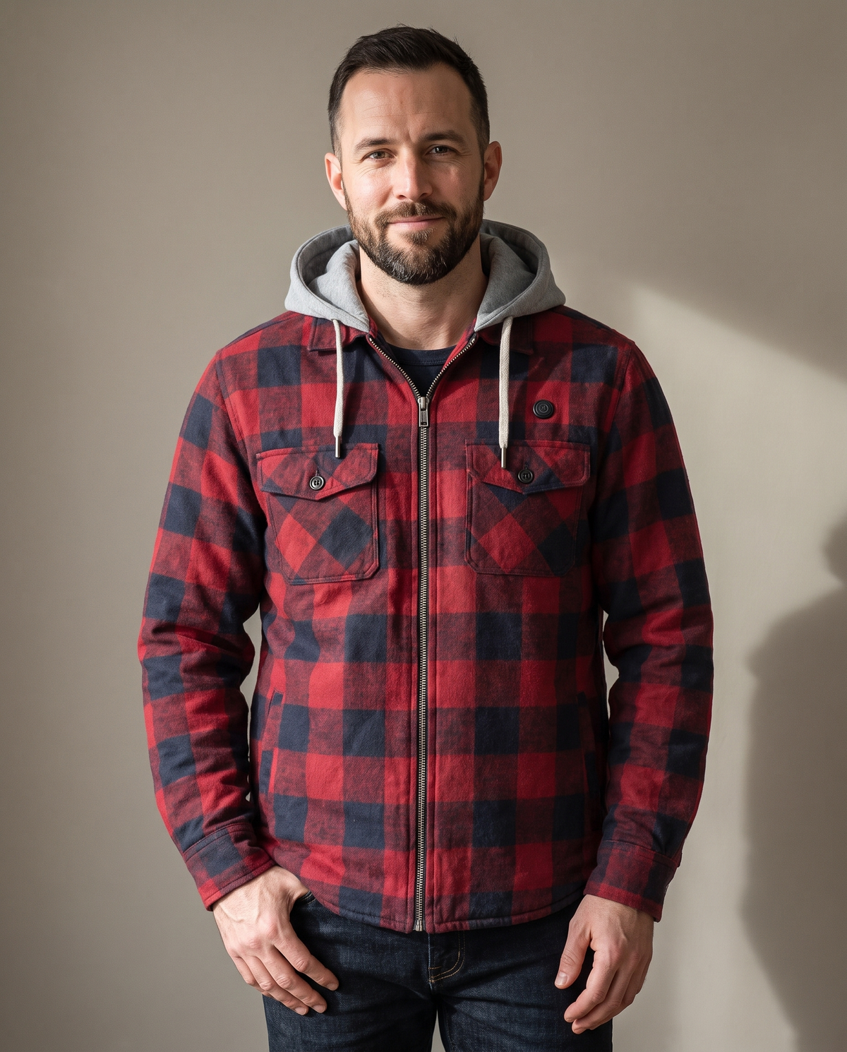 Man wearing the Cozy Flannel Co. men's heated flannel jacket in red and navy buffalo check