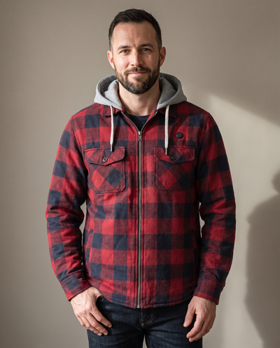 Man wearing the Cozy Flannel Co. men's heated flannel jacket in red and navy buffalo check